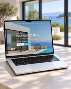 Web stranica tvrtke Alanis za PVC i ALU stolariju prikazana na laptopu.